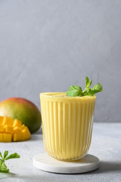Premium Photo Indian Mango Or Turmeric Lassi On Gray Background