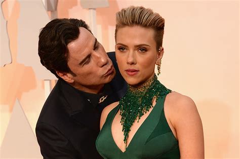 Why Is John Travolta Kissing Scarlett Johansson On The Cheek