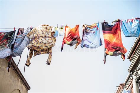 Clothes Hanging From A Clothes Line Rope In A Street Stock Photo