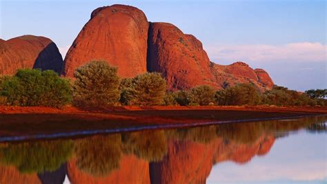 Spotlight automatically get and rotates pictures on a user's secure display. Olgas or Kata Tjuṯa rock formations in Northern Territory ...