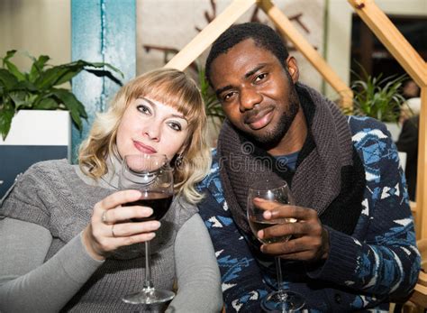 Portrait Of Happy Couple Black Man And White Woman With Glass Of Wine
