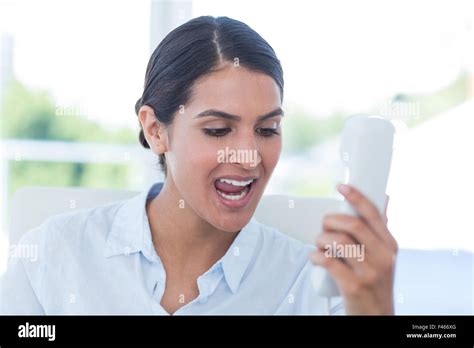 Businesswoman Yelling At Her Phone Stock Photo Alamy