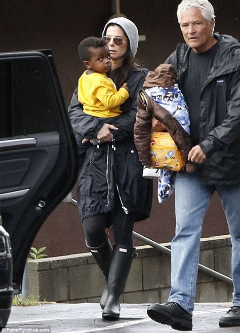 Sandra Bullocks Son Louis Is A Ray Of Sunshine On A Drizzly Day