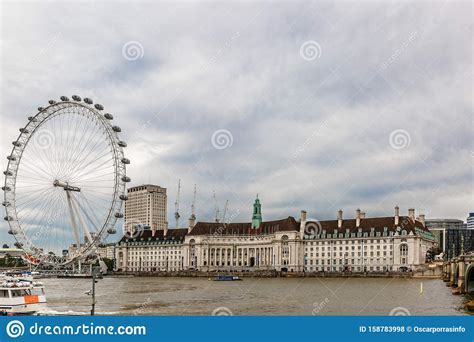 View Of The River Thames With The London Eye Ferris Wheel On The Left