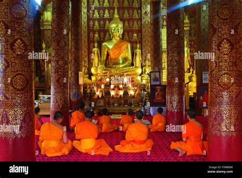 Buddhist Monks At Worship In Wat Sen Temple In Luang Prabang Laos