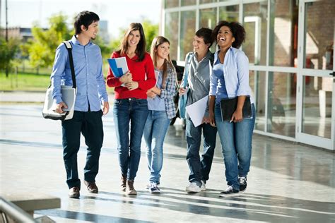 Cheerful Students Walking On Campus Smp Marsudirini