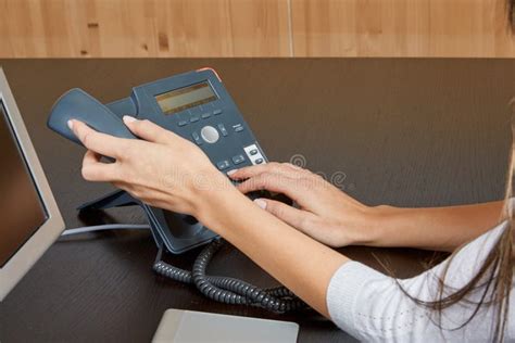 Businesswoman Dialing Telephone Stock Photo Image Of Looking Paper
