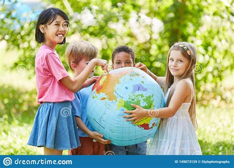 Multicultural Group Of Kids Holds World Globe Stock Image - Image of ...