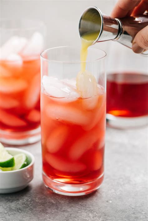 Cranberry-Vodka-cocktail-with-orange-juice-pouring - The ...