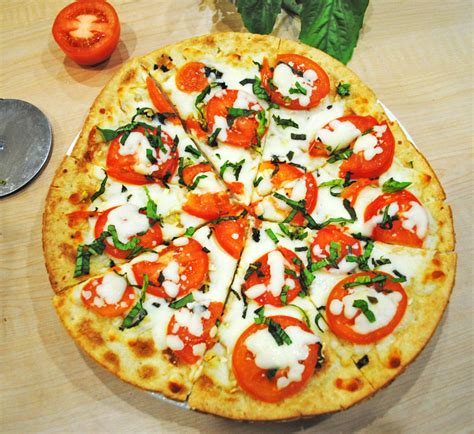 Stretch out and pat 1 dough ball to form a circle 10 to 12 inches in diameter. Margherita Flatbread Pizza - Recipe Treasure