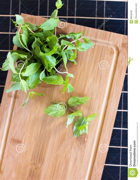 Fresh Mint In A Wooden Brown Bowl On The Table Stock Photo Image Of