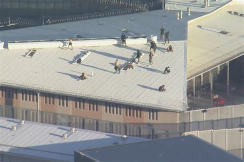 parklea correctional centre breakout inmates climb onto roof at western sydney prison