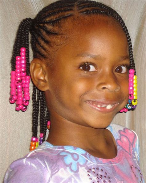 A classic girls' hairstyle, hair is set in multiple simple twists and embellished with colorful barrettes or hair ties that can be changed daily to match different outfits to correspond with your little girls ootd. Cute Braided Hairstyles for Black Girls trends hairstyle