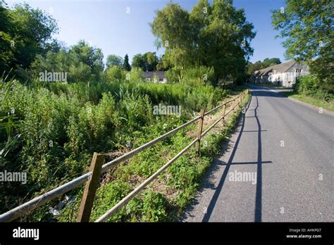 Quiet Country Road And Railings Stock Photo Alamy