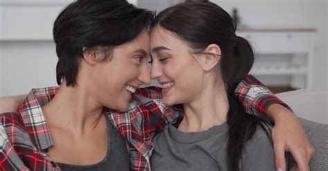 Happy Lesbian Lgbtq Couple Enjoying Bonding Hugging Cuddling And