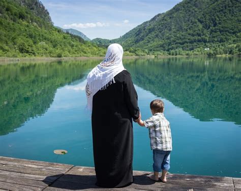 Premium Photo Muslim Arabic Mother With Her Son On The Lake