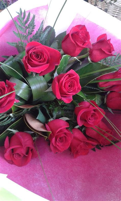 A Dozen Red Roses Beautifully T Wrapped Red Roses Dozen Red Roses