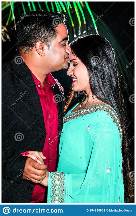Romantic Indian Couple Spending Leisure Time At Night Stock Photo