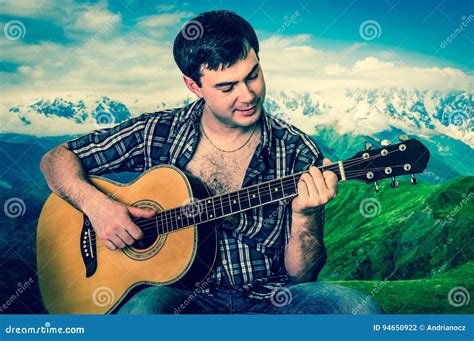 Attractive Man Playing Acoustic Guitar Retro Style Stock Photo