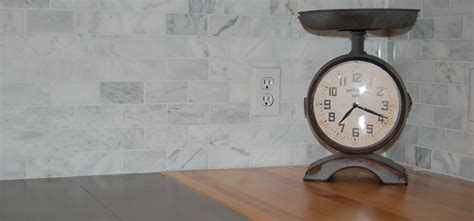 Is butcher block coming back in style. Marble subway tile backsplash with concrete-style slab ...