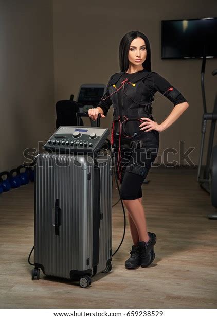 Beautiful Brunette Girl Electrical Muscular Stimulation Stock Photo