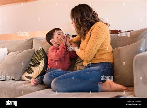Mother And Son Relaxing Together In The Living Room Stock Photo Alamy