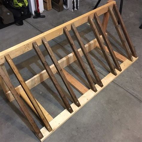 This diy bike rack is super simple in terms of design and also really easy to put together. RYOBI NATION 2X4 Bike Rack | Diy bike rack, Wood bike rack, Bike rack