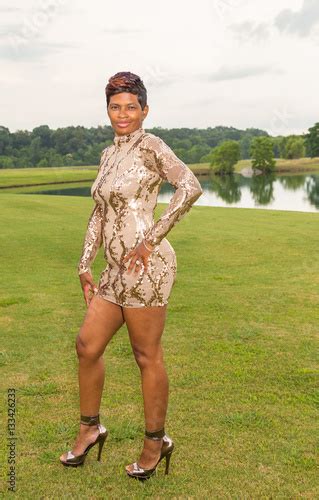 beautiful sexy over forty african american woman outdoor full body portrait shot of a beautiful
