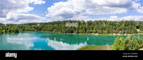 Aerial Panoramic View Of Abandoned Quarry Flooded With Turquoise Clear
