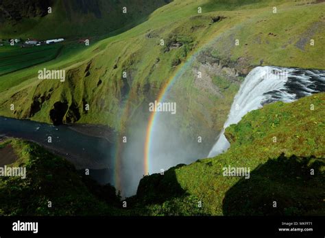 Rainbow Over Skogafoss Waterfalls Iceland Stock Photo Alamy