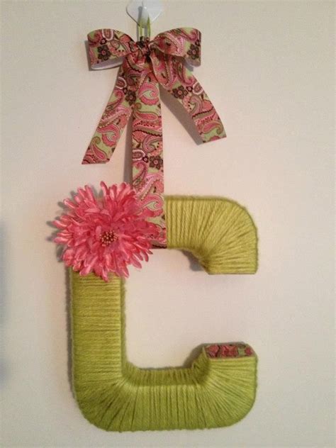 Yarn Wrapped Letter Decorated With Coordinating Ribbon And Flowers