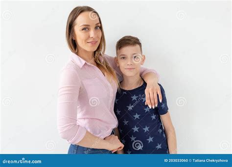 Good Looking Single Parent Mom And Teen Son On White Background
