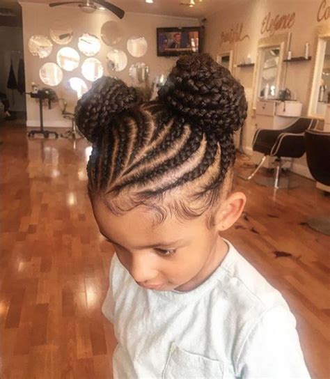 This hairstyle is adequate for those girls who want to maintain their hair free but still show some class. 15 Adorable Braided Buns For Little Girls - AfroCosmopolitan