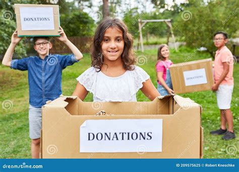 Children Collecting Donations For Clothing Collection Stock Image
