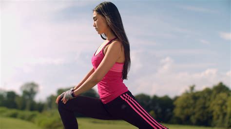 Woman Doing Lunges Outdoor Fitness Woman Stretching Legs In Park At