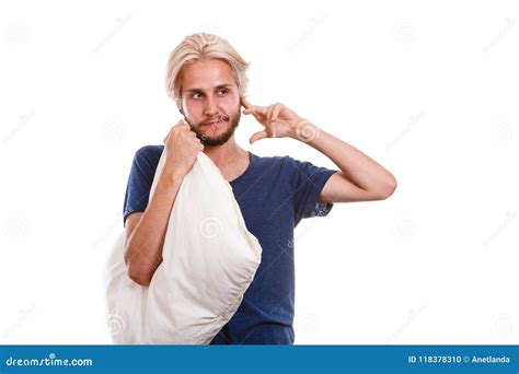Sleepy Man With Pillow Closing His Ear Stock Photo Image Of Tired