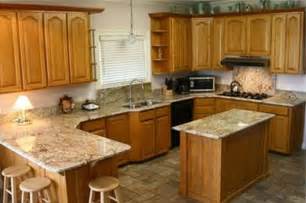 Plus bigger cabinet span like our layout. golden oak cabinets with quartz - Google Search | Kitchens ...