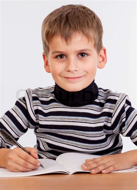Cute Schoolboy Is Writting Stock Image Colourbox