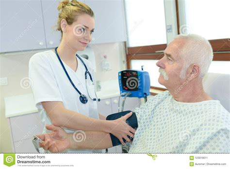 Nurse Checking Hospital Patients Blood Pressure Stock Image Image Of