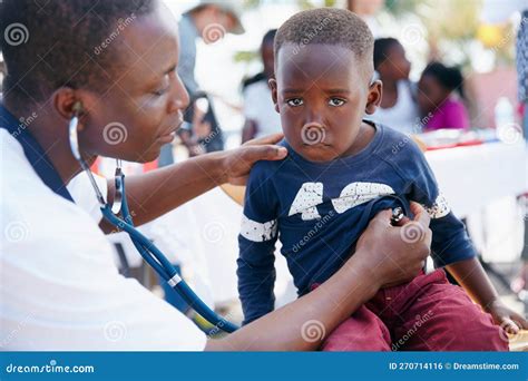 Keeping Kids Healthy. Shot of a Volunteer Doctor Giving Checkups To