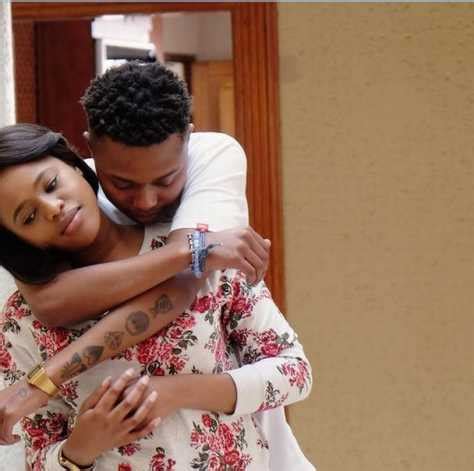A yellow face with a broad, closed smile wearing black sunglasses, as if a pair of classic wayfarers. JOZIWEB: Natasha Thahane and A-Reece the rapper set the record straight
