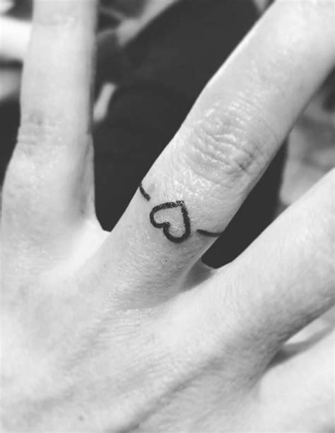 40 Simply Stunning Wedding Ring Tattoos For Couples Tattoo Wedding Rings Wedding Band Tattoo