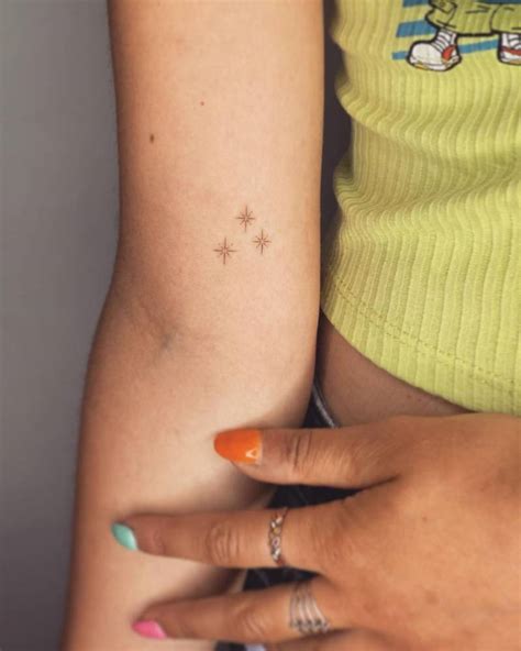 Tiny Stars Tattooed On The Inner Arm Minimalistic