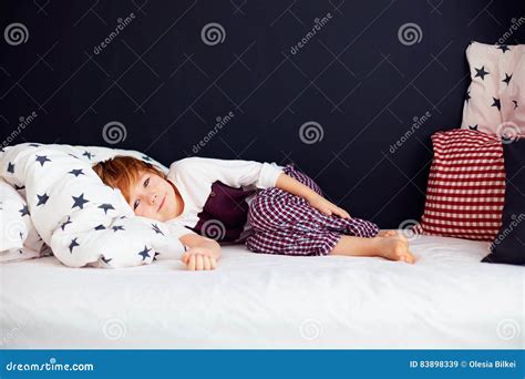 Cute Kid Wearing Pajamas Relaxed Boy Lying In Bed Stock Image Image