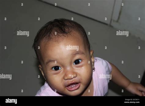 A Cute Beautiful Indonesian Baby Girl Playing In The House Stock Photo Alamy
