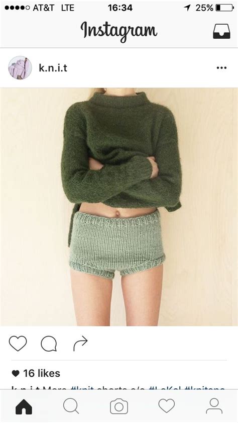 A Woman In Green Sweater And Shorts With Her Arms Crossed