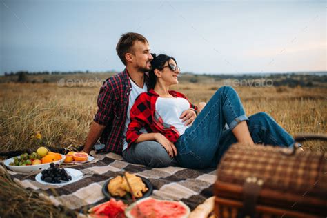 Romantic picnic ideas are perfect for any couple. Love couple, picnic on plaid in summer field Stock Photo ...