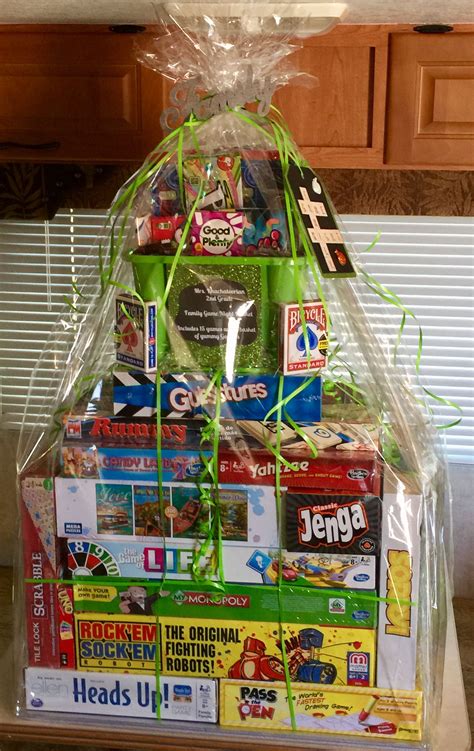 One awesome summer giveaway prize idea is a set of tickets to a specific summer event. Family game night raffle basket | Family gift baskets ...