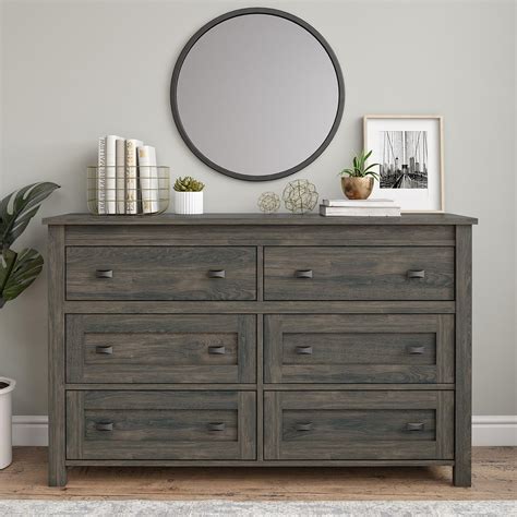 Equipped with six sliding drawers that feature safety stops to prevent the drawers from falling out, this dresser offers a wealth of storage space. Ameriwood Home Farmington 6 Drawer Dresser, Weathered Oak ...