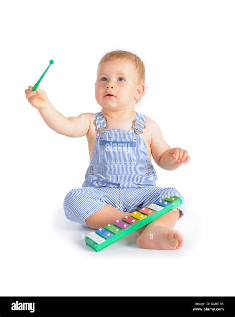Cheerful Baby Boy Playing On Xylophone Isolated Over White Background
